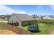 Spacious backyard featuring a trampoline, privacy fence, and manicured lawn for outdoor enjoyment at 145 Bounding Ln, Youngsville, NC 27596