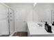 Bright bathroom offers double vanity, modern fixtures, and glass shower providing a luxurious experience at 145 Bounding Ln, Youngsville, NC 27596