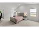 Bright bedroom features vaulted ceiling, carpet floors, and modern finishes to enhance appeal at 145 Bounding Ln, Youngsville, NC 27596