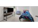 Bedroom includes a workstation area featuring a black framed desk with shelves, and dresser at 145 Bounding Ln, Youngsville, NC 27596
