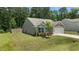 Charming home featuring a well-maintained lawn, two car garage, and privacy fence at 145 Bounding Ln, Youngsville, NC 27596
