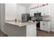 Modern kitchen features granite countertops, stainless steel appliances, and ample cabinet space at 145 Bounding Ln, Youngsville, NC 27596