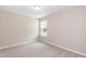 Bedroom featuring a window and plush carpet at 157 Lynn Dr, Clayton, NC 27520
