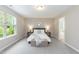 Cozy bedroom with neutral colors, comfortable furnishings, and a relaxing atmosphere at 157 Lynn Dr, Clayton, NC 27520