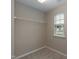 Walk-in closet with window, shelf, and plush carpet at 157 Lynn Dr, Clayton, NC 27520