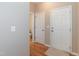 Clean, open foyer featuring neutral walls, hard wood flooring, and a view of a nearby bathroom at 157 Lynn Dr, Clayton, NC 27520