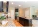Modern kitchen featuring granite counters, stainless steel appliances, and a functional kitchen island at 157 Lynn Dr, Clayton, NC 27520