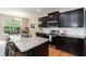 Stylish kitchen boasts granite countertops, stainless steel appliances, and dark wood cabinetry at 157 Lynn Dr, Clayton, NC 27520