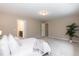 Spacious main bedroom with carpet, plant, and a view to the bathroom and bedroom at 157 Lynn Dr, Clayton, NC 27520