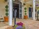 Charming barn entrance with decorative planters, brick walkway, and classic design elements at 1624 Hopkins Rd, Bahama, NC 27503