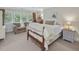 Cozy bedroom with window seating, neutral decor and comfortable furnishings at 1624 Hopkins Rd, Bahama, NC 27503