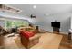 Spacious bonus room with beamed ceiling, comfortable furniture, and mounted television at 1624 Hopkins Rd, Bahama, NC 27503