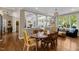 Open dining room with hardwood floors, an elegant table, and views into living spaces at 1624 Hopkins Rd, Bahama, NC 27503