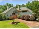 Charming two-story home with manicured landscaping, brick walkway, and inviting entrance at 1624 Hopkins Rd, Bahama, NC 27503
