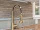 Elegant kitchen featuring an artistic and functional pull-down gold faucet at 1624 Hopkins Rd, Bahama, NC 27503