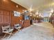 A well-maintained horse stable with ample space, featuring stalls, wooden doors, and vintage seating at 1624 Hopkins Rd, Bahama, NC 27503