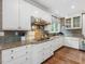 Spacious kitchen with granite countertops, gas cooktop, stainless appliances, and custom cabinets at 1624 Hopkins Rd, Bahama, NC 27503