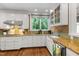 Bright kitchen with granite countertops, stainless appliances, and cabinetry with stylish hardware at 1624 Hopkins Rd, Bahama, NC 27503
