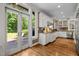 Well-equipped kitchen with granite countertops, and a patio with an exterior grilling area at 1624 Hopkins Rd, Bahama, NC 27503