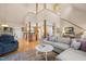 Inviting living room featuring hardwood floors, an open floor plan, and staircase to the upper level at 1624 Hopkins Rd, Bahama, NC 27503