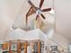 An expansive living room area with soaring ceilings, exposed wood beams, and a skylight at 1624 Hopkins Rd, Bahama, NC 27503
