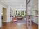 Inviting living room with hardwood floors, large windows, fireplace, and comfortable seating at 1624 Hopkins Rd, Bahama, NC 27503