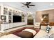 Inviting living room with built-in bookshelves, a cozy fireplace, and comfortable seating at 1624 Hopkins Rd, Bahama, NC 27503