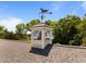 Close up on roof cupola with horse weather vane detail, surrounded by lush green trees against a clear blue sky at 1624 Hopkins Rd, Bahama, NC 27503