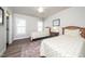 Cozy bedroom with two twin beds, matching lamps, and a neutral color scheme at 1705 Main Divide Dr, Wake Forest, NC 27587