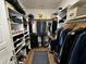 A spacious walk-in closet with ample shelving and hanging space for organization at 1705 Main Divide Dr, Wake Forest, NC 27587