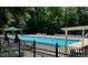 Enjoy the community pool with plenty of chairs on a sunny day at 1705 Main Divide Dr, Wake Forest, NC 27587