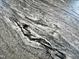 Close-up showcasing the beautiful granite countertop with unique veining and texture at 1705 Main Divide Dr, Wake Forest, NC 27587