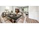 Formal dining room featuring a large table, chandelier, and decorative wainscoting at 1705 Main Divide Dr, Wake Forest, NC 27587
