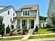 Charming two-story home with a cozy front porch, landscaped yard, and a delightful curb appeal at 1705 Main Divide Dr, Wake Forest, NC 27587
