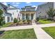 Charming two-story home with a welcoming front porch and manicured landscaping at 1705 Main Divide Dr, Wake Forest, NC 27587