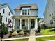 Charming two-story home with a cozy front porch, landscaped yard, and a delightful curb appeal at 1705 Main Divide Dr, Wake Forest, NC 27587