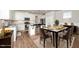 Open-concept kitchen and dining area, perfect for entertaining guests and enjoying Gathering meals at 1705 Main Divide Dr, Wake Forest, NC 27587