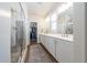 Spacious main bathroom featuring double sinks, modern fixtures, and a glass-enclosed shower at 1705 Main Divide Dr, Wake Forest, NC 27587