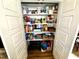 Walk-in pantry with ample shelving space, providing plenty of room for storing groceries and household items at 1705 Main Divide Dr, Wake Forest, NC 27587