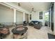 Spacious covered patio with outdoor seating and a modern stone fire pit at 1705 Main Divide Dr, Wake Forest, NC 27587