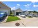 Street view of a neighborhood with driveways and a blue and a white car at 1705 Main Divide Dr, Wake Forest, NC 27587