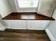 A window seat featuring a dark wood surface and white cabinets at 1705 Main Divide Dr, Wake Forest, NC 27587
