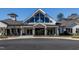 Community center with peaked roof, clerestory windows, covered porch, and rocking chairs at 1816 Gazania Dr, Fuquay Varina, NC 27526