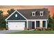 Charming single-Gathering home with inviting curb appeal and attached two-car garage at 1905 Gazania Dr, Fuquay Varina, NC 27526