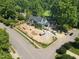 Aerial view of home under construction in a tranquil, wooded neighborhood at 1925 Hunting Ridge Rd, Raleigh, NC 27615