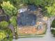New home under construction with a modern roof design nestled within a lush green neighborhood at 1925 Hunting Ridge Rd, Raleigh, NC 27615