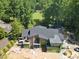 Aerial view of home under construction, featuring a large backyard surrounded by mature trees at 1925 Hunting Ridge Rd, Raleigh, NC 27615