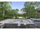 View of an unfinished pool and backyard with a golf course in the distance at 1925 Hunting Ridge Rd, Raleigh, NC 27615