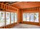 Spacious unfinished living area displays exposed framing and large windows, offering an abundance of natural light at 1925 Hunting Ridge Rd, Raleigh, NC 27615