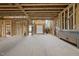 Spacious unfinished living room featuring wood framing and multiple access points at 1925 Hunting Ridge Rd, Raleigh, NC 27615